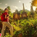 Third-female-traveler-with-backpack-walking-and-looks-at-sunset-among-ancient-Buddhist-stupas-of-the-temple-complex-In-Dein-Inle-Lake.-Mayanmar-728×486